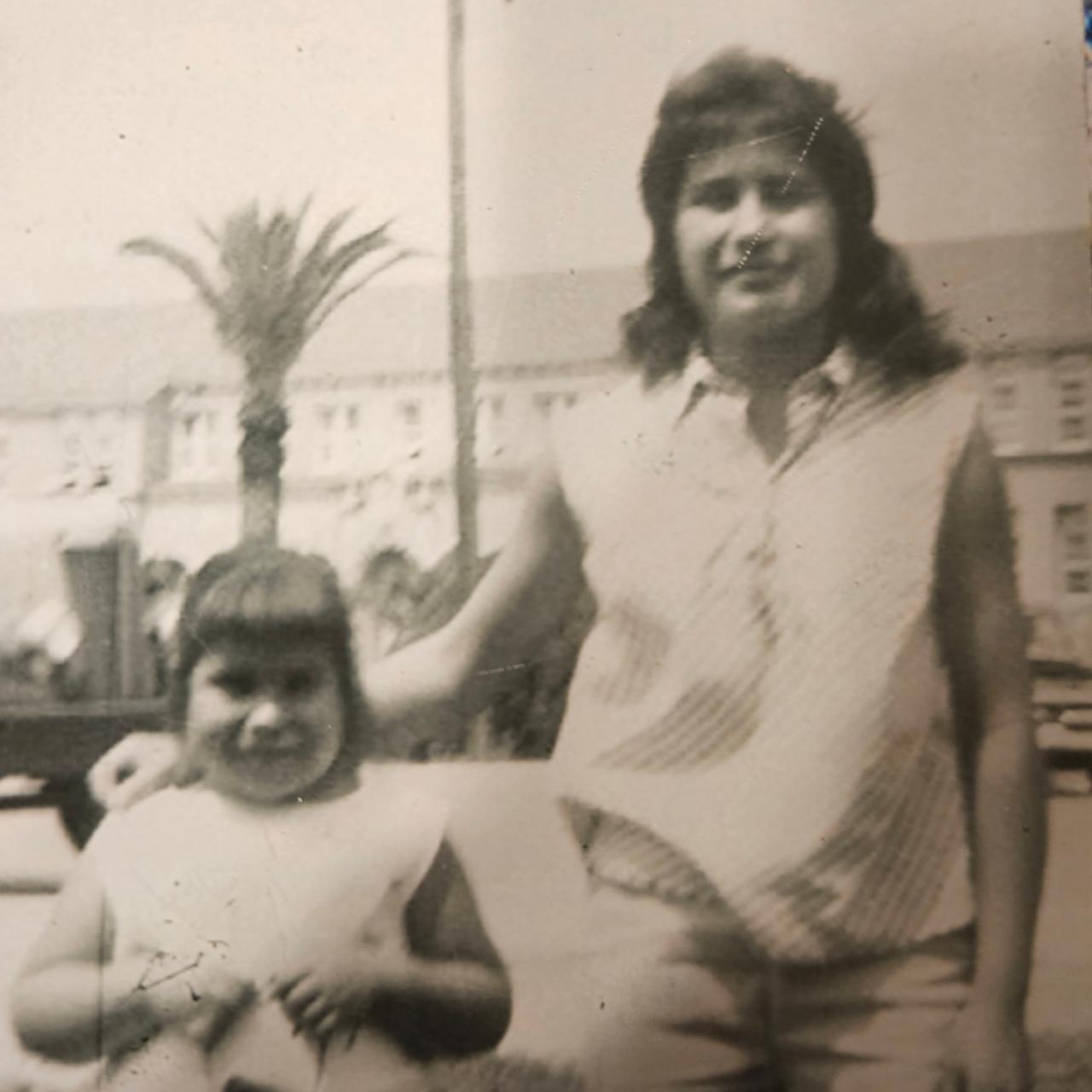 Eva Osuna 1961 with Olivia Osuna Delgado in front of Old Main